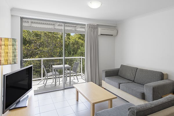 Oaks holiday Resort Port Douglas lounge room with tv and air conditioning