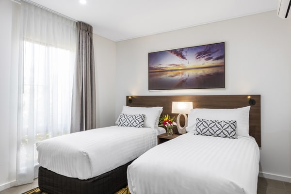 two single beds in air conditioned hotel room with Wi-Fi access in 2 Bedroom Apartment at Oaks Cable Beach Sanctuary, Broome, Western Australia