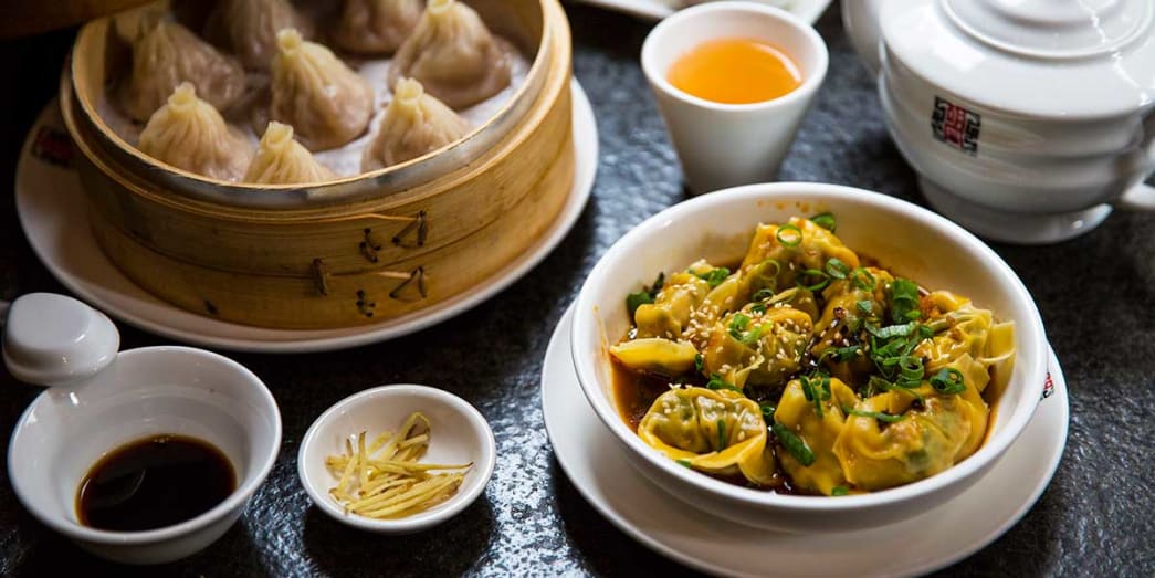 A bowl of dumplings with hot chili sauce at HuTong