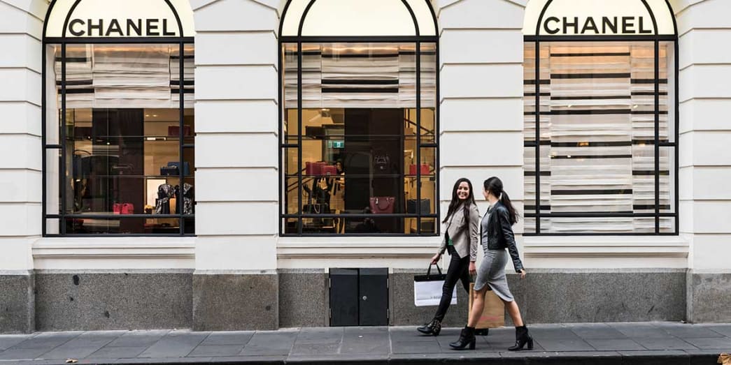 Two girls walk along the streets of Melbourne during the Melbourne Fashion Week