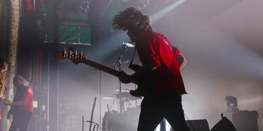 A band guitarist on stage performing live local and international music acts at the Fortitude Valley Music Open