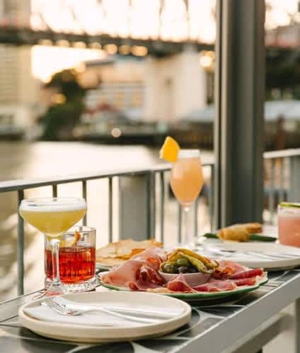 Cocktail drinks and dishes by the Brisbane river