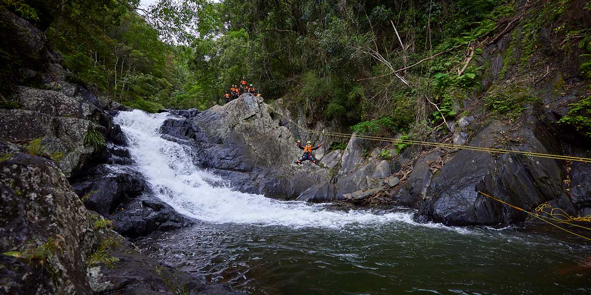 Crystal Cascades' secluded freshwater swimming holes and waterfalls featuring huge granite boulders
