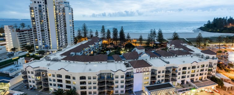 aerial view of Oaks Calypso Plaza hotel in Coolangatta with ocean walking distance away in background, Queensland, Australia