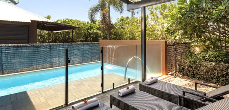 sun loungers in private courtyard of hotel apartment with private swimming pool in Broome, Western Australia