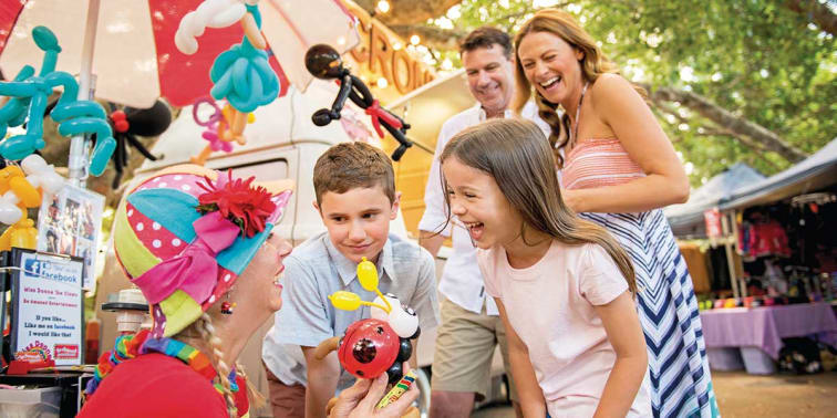 Children having fun at the play areas with their parents