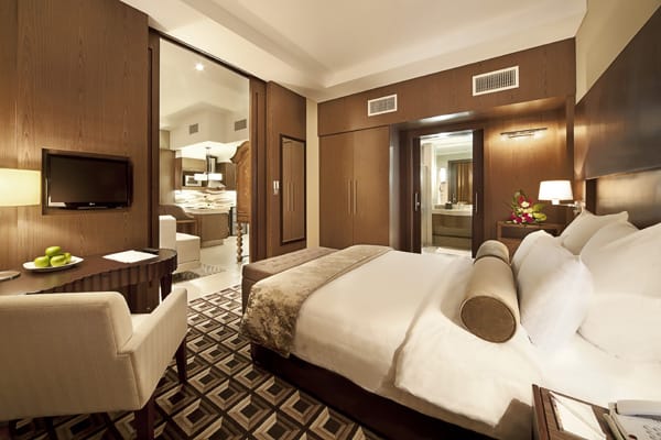 air conditioned bedroom with Wi-Fi access, comfortable double bed with clean sheets, en suite bathroom and satellite TV with foreign channels at Oaks Liwa Executive Suites hotel in Abu Dhabi, United Arab Emirates