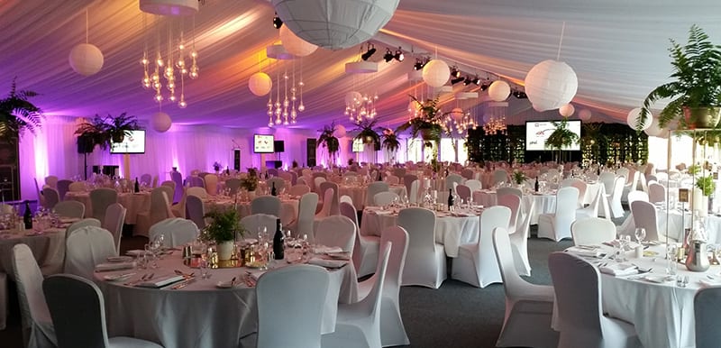 large function venue with microphone projector seating and speaker stand in hunter valley