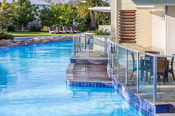 Port Stephens resorts with air conditioning and balcony extending over australias largest swimming pool at Oaks Pacific Blue resort hotel in NSW