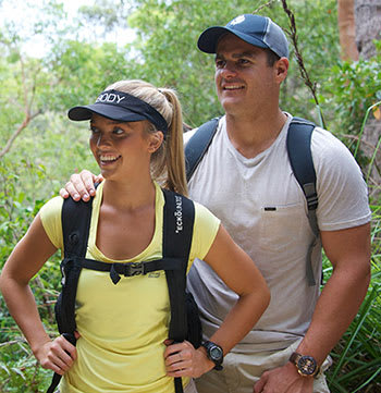 Couple bushwalking through Tomaree National Park New South Wales