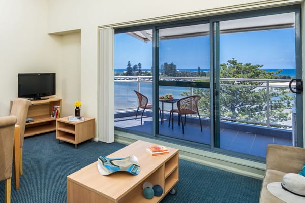 Central Coast resorts living room area in ocean view studio hotel apartment in The Entrance