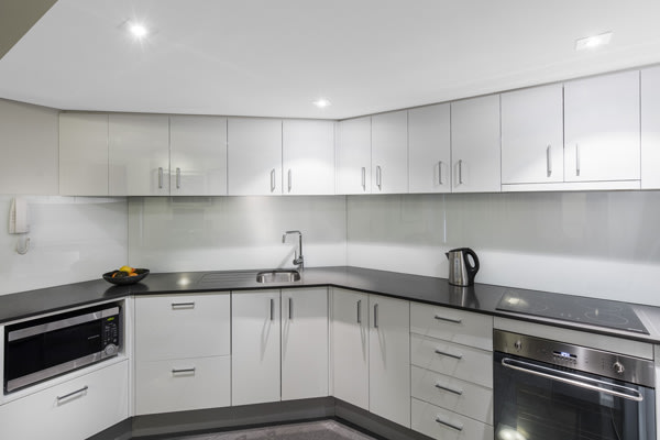 large modern kitchen area in 2 bedroom hotel apartment near Hyde Park in Sydney