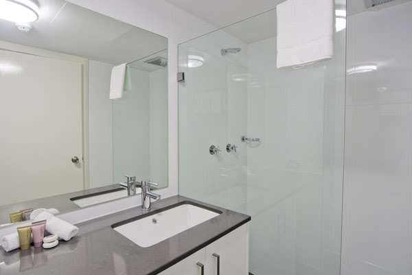 4 star hotel studio room with modern en suite bathroom, shower and toilet