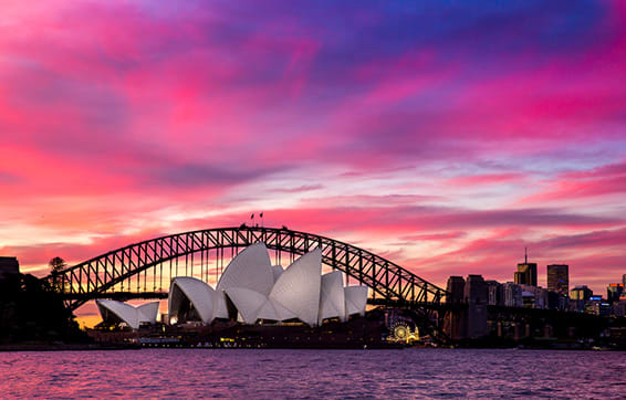 darling harbour and sydney opera house pink sunset in summer