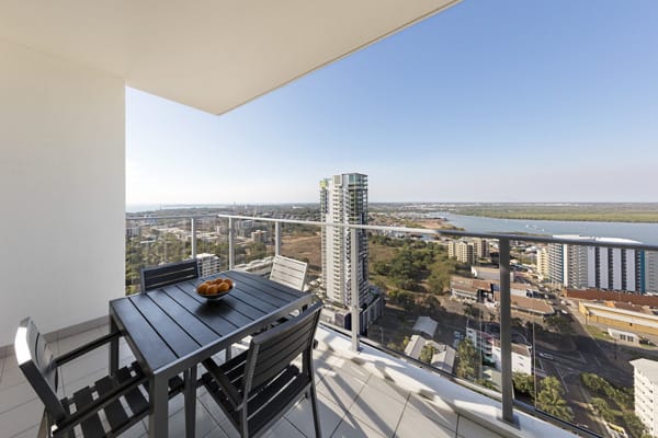 large balcony with table and chairs with views of Darwin Harbour from Oaks Elan Darwin hotel