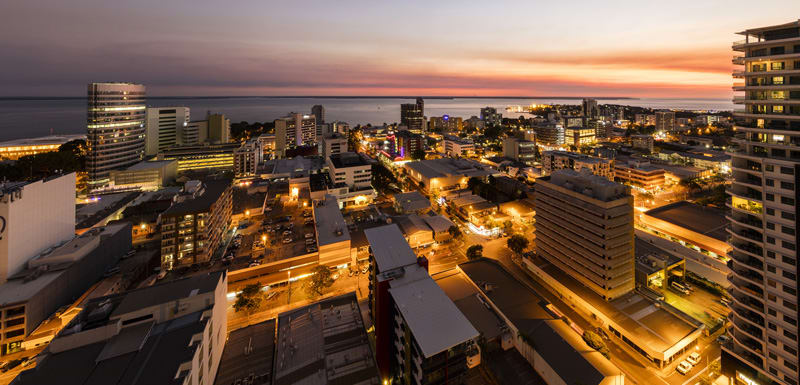 aerial view of Darwin city at sunset with ocean in background