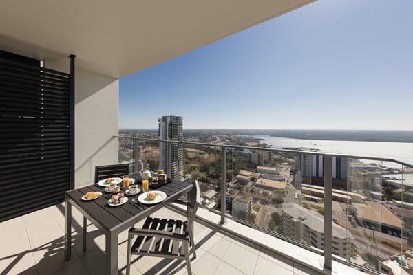large balcony with breakfast on table in the morning at 2 bedroom apartment at Oaks Elan Darwin hotel