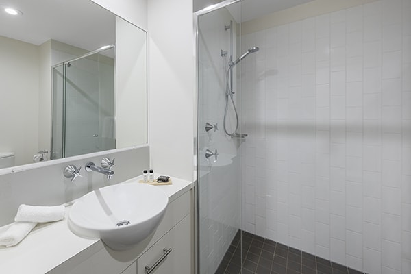 clean bathroom with walk-in shower at 2 Bedroom apartment of Oaks 212 Margaret brisbane hotel