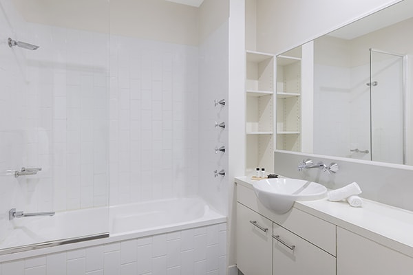clean bathroom with bathtub at oaks 212 margaret 4 bedroom brisbane hotel