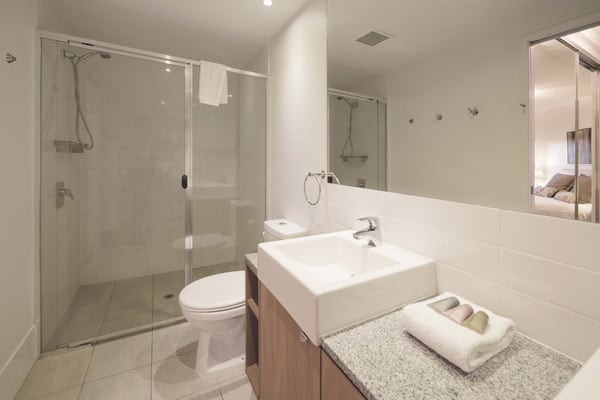 en suite bathroom with large shower and toilet in 1 bedroom executive hotel apartment in Brisbane city