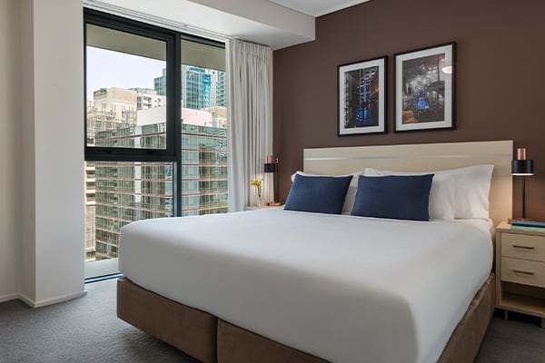 Bedroom with nice city view at Oaks Brisbane Felix Suites 1 Bed Apartment 