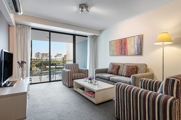 Spacious living space and balcony at Oaks Brisbane Felix Suites 2 Bed Apartment 