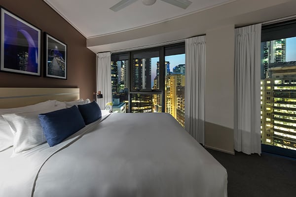 Oaks Brisbane on Felix Suites 2 Bedroom Story Bridge View Bedroom one with king sized bed and night city view