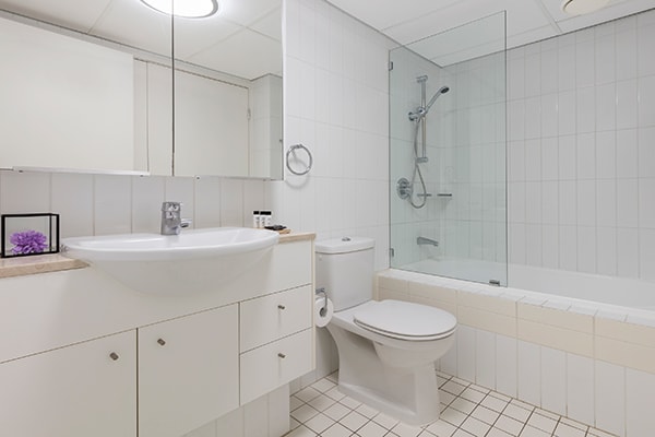 bathroom one with bathtub at Oaks Brisbane on Felix Suites 2 Bedroom Story Bridge View 