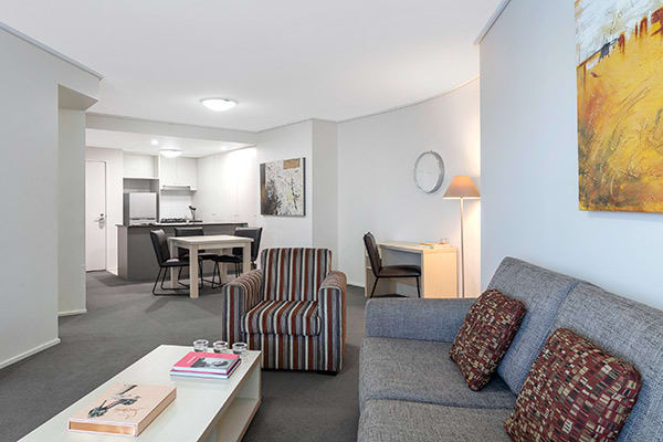 spacious living room with desk for corporate travellers to do work whilst on business trip to Brisbane city