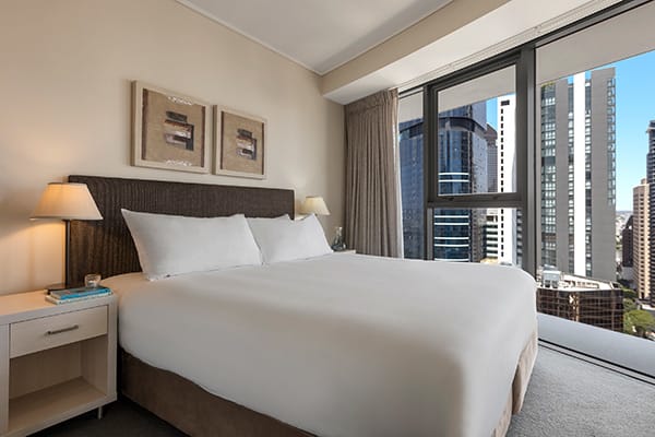 Oaks Brisbane Felix Suites 3 Bed Apartment Bedroom with city view 