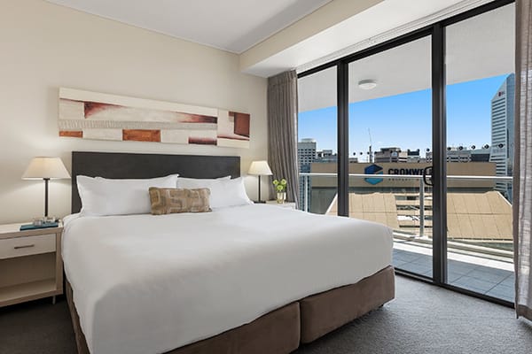 Oaks Brisbane Felix Suites 3 Bed Apartment Bedroom 3 with a private balcony attached and city view 