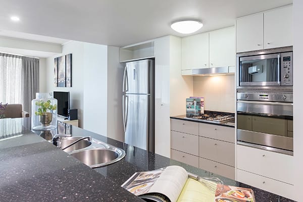 fully equipped kitchen at Oaks Brisbane Felix Suites 3 Bed Apartment Kitchen