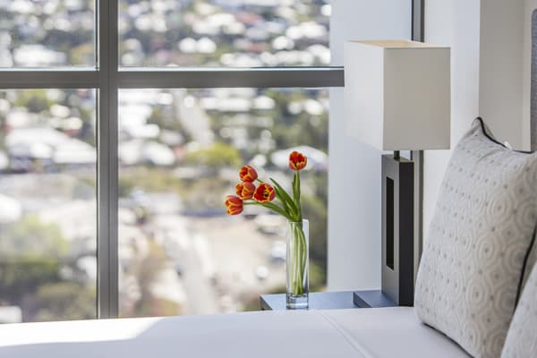 clean bed sheets in 1 bedroom apartment with views of Brisbane at The Milton hotel