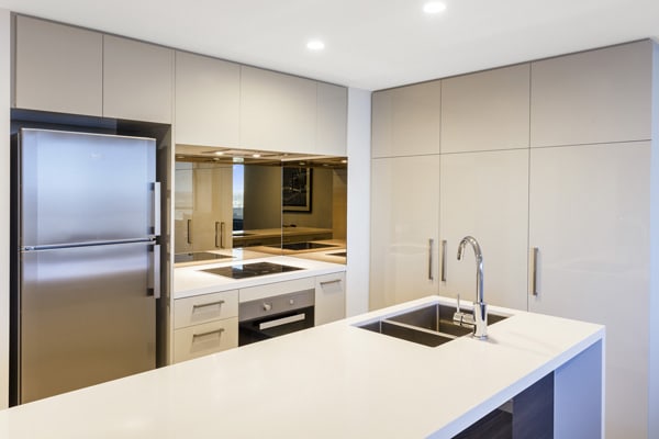 kitchen with microwave, big fridge and oven in 2 bedroom apartment at The Milton Brisbane hotel