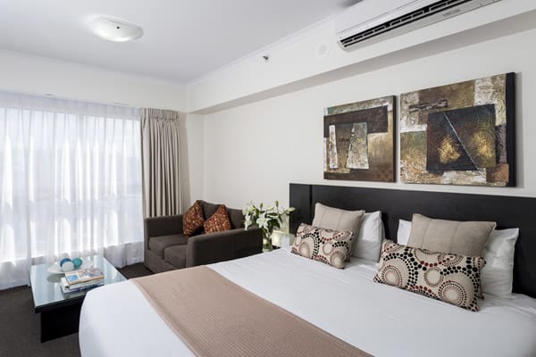 Hotels In Ipswich with queen size bed in studio apartment at Oaks Aspire hotel in Ipswich, Queensland, Australia