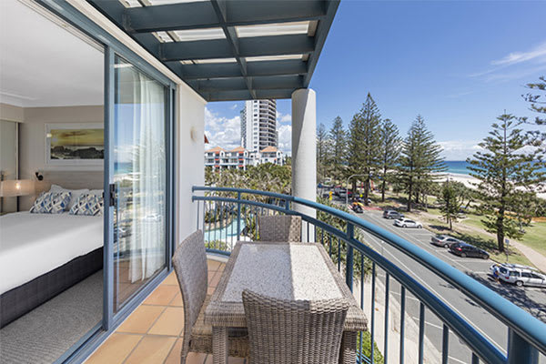 view of park and ocean from one bedroom ocean premier apartment at Oaks Calypso Plaza resort in Gold Coast, Australia
