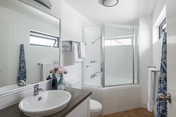 en suite bathroom in two bedroom apartment near beach in Coolangatta with shower, clean towels and toilet
