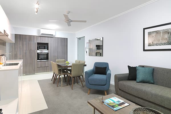 living room of 3 bedroom dual key apartment at Oaks Carlyle hotel in Mackay with air con and wi-fi