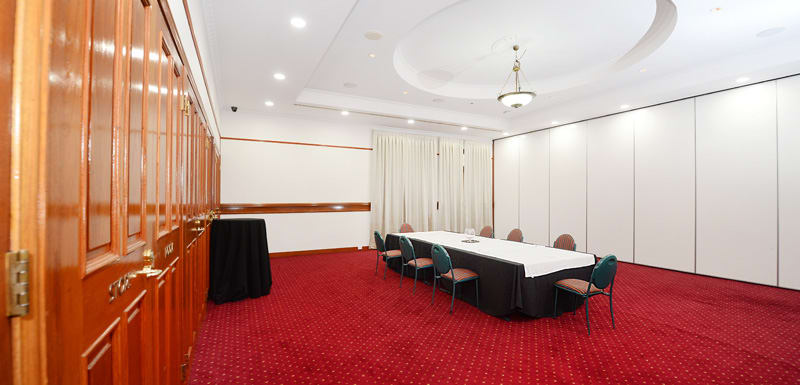 large functions room at Oaks Grand Gladstone hotel with catering, furniture and microphone for speakers