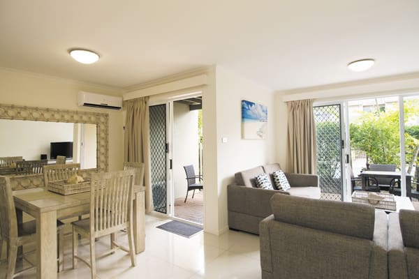 spacious living room area in Caloundra hotels 3 bedroom villa with air conditioning and private balcony at Oaks Oasis Resort hotel in Caloundra
