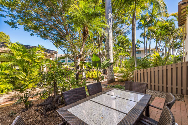 table and chairs on private balcony of 3 bedroom villa at Oaks Oasis Resort hotel in Caloundra on Sunshine Coast, Queensland, Australia
