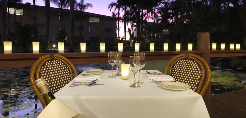 table for 2 on romantic date with bottle of wine and glasses at Reflections Restaurant and Bar in Caloundra, Sunshine Coast
