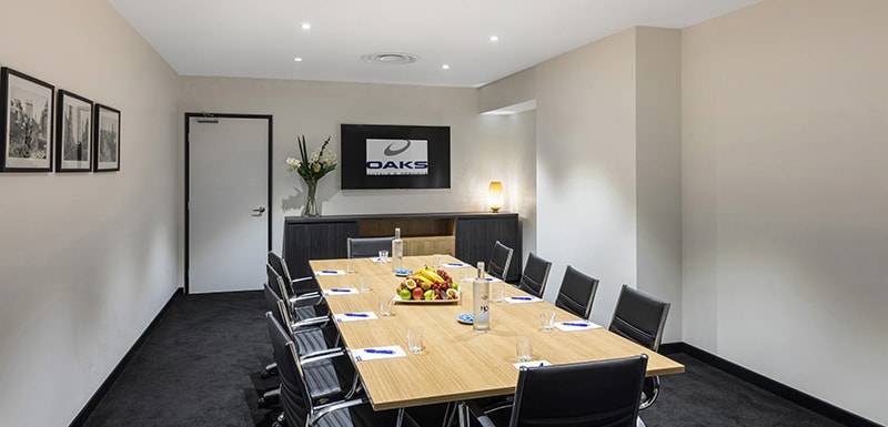 long table with healthy lunch, chairs and television for PowerPoint presentations with Wi-Fi access and air conditioning in Adelaide CBD near Convention Centre
