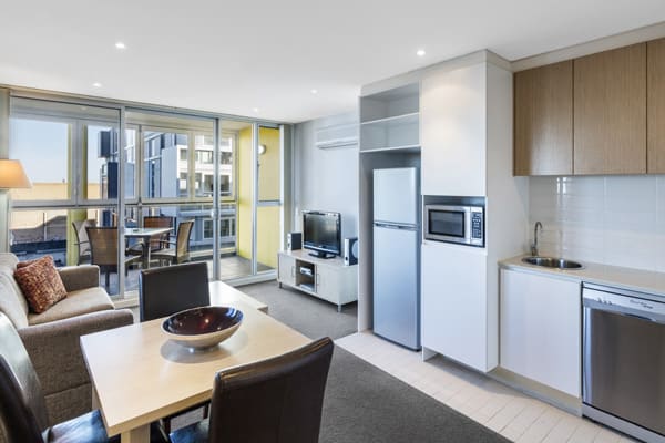 kitchenette with microwave and fridge, freezer in open plan 2 bedroom apartment with private balcony near Adelaide Convention Centre with free Wi-Fi