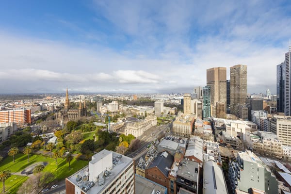 panoramic view of Melbourne CBD at midday from large private balcony of 1 bedroom apartment at Oaks on Lonsdale hotel, Melbourne city, Victoria, Australia