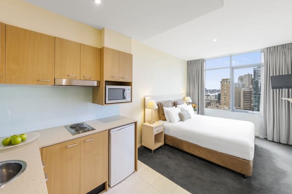 spacious master bedroom in 3 Bed Apartment with microwave, fridge and kettle at Oaks On Lonsdale hotel in Melbourne city, Victoria, Australia