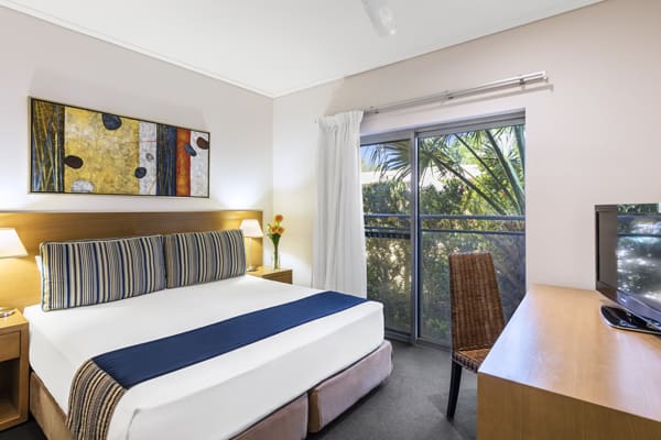 comfortable double bed in air conditioned 1 bedroom apartment with Foxtel at Oaks Broome hotel, Western Australia