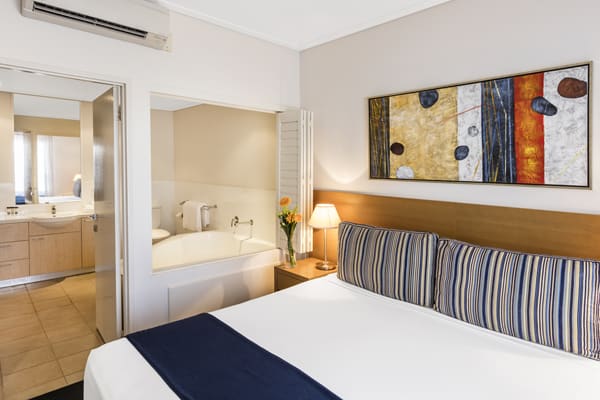 air conditioned 1 bedroom hotel apartment in Broome with en suite bathroom and beautiful artwork on walls in Western Australia