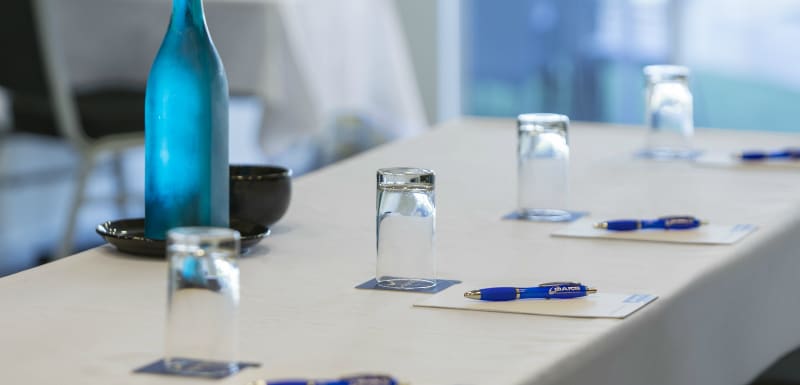 pens on notepads on table in air conditioned conference room for hire with catering in Broome, Western Australia