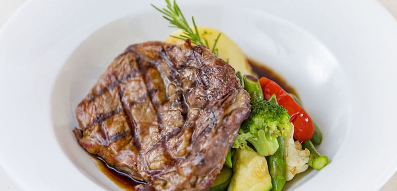 steak and vegetables on plate from popular Cable Beach restaurants delicious seafood menu in Broome, Western Australia